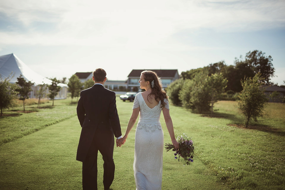 Bride Alison wears a beaded Eliza Jane Howell wedding dress for her glamorous and whimsical summer wedding. Captured by Tom Ravenshear Phtography.