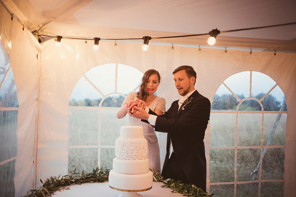 Bride Alison wears a beaded Eliza Jane Howell wedding dress for her glamorous and whimsical summer wedding. Captured by Tom Ravenshear Phtography.