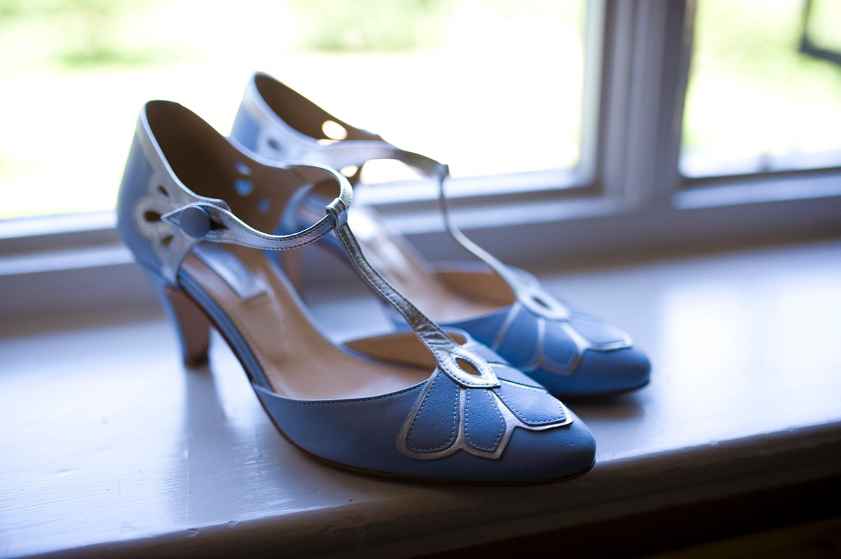 Bride Alice wore a chic, Charlie Brear column style gown for her 1920's and books/literary inspired summer barn wedding. Images by Richard Beaumont.