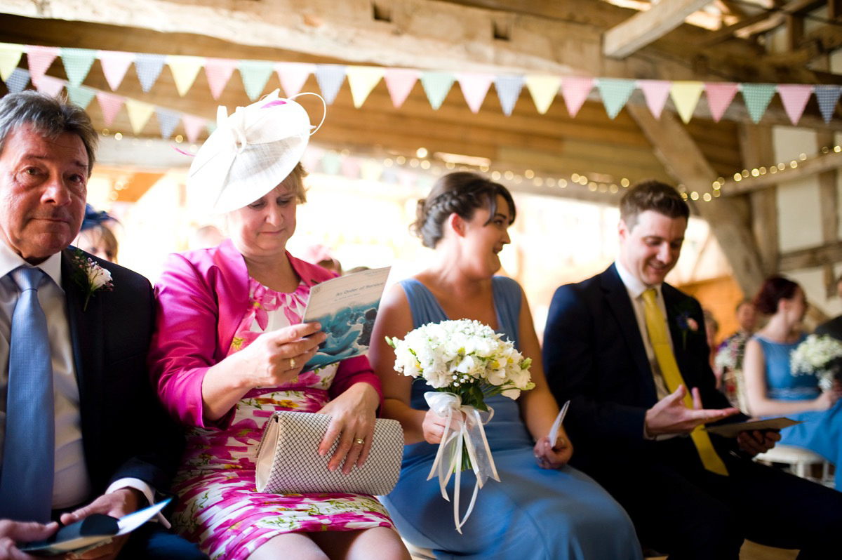 Bride Alice wore a chic, Charlie Brear column style gown for her 1920's and books/literary inspired summer barn wedding. Images by Richard Beaumont.