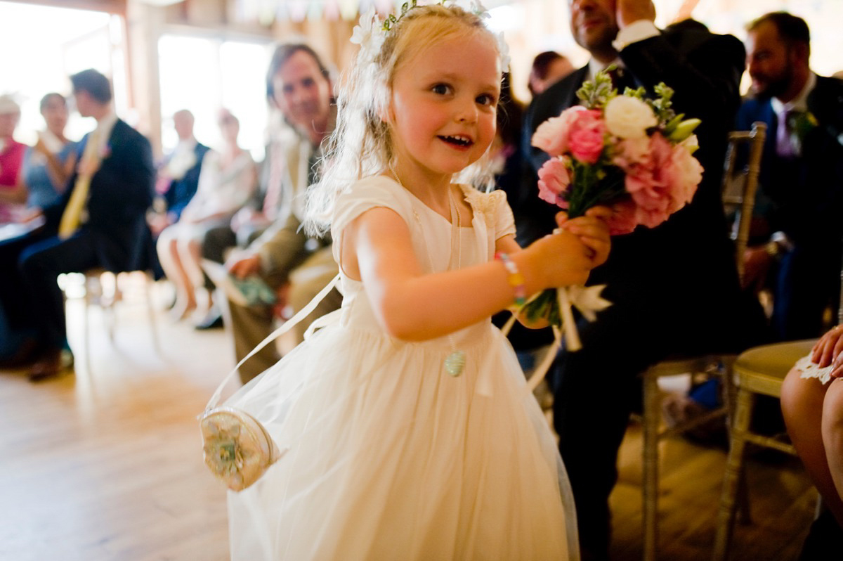 Bride Alice wore a chic, Charlie Brear column style gown for her 1920's and books/literary inspired summer barn wedding. Images by Richard Beaumont.