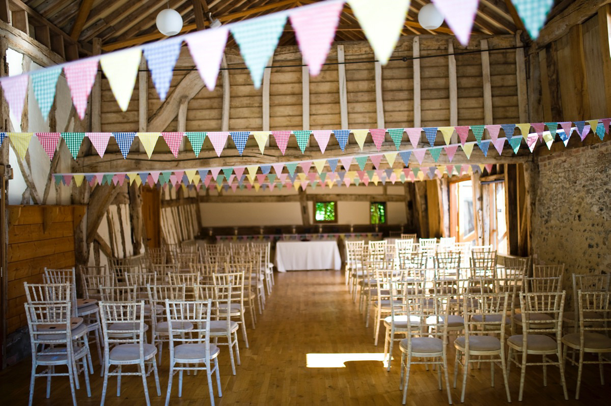 Bride Alice wore a chic, Charlie Brear column style gown for her 1920's and books/literary inspired summer barn wedding. Images by Richard Beaumont.