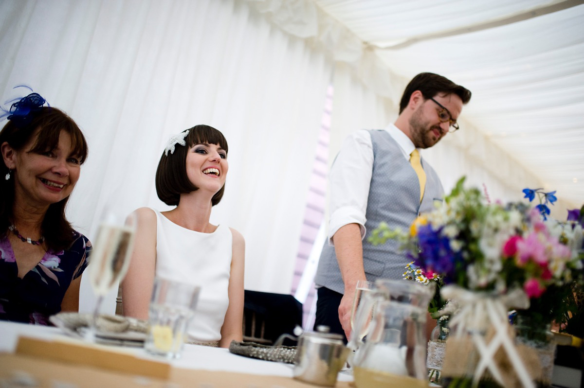 Bride Alice wore a chic, Charlie Brear column style gown for her 1920's and books/literary inspired summer barn wedding. Images by Richard Beaumont.