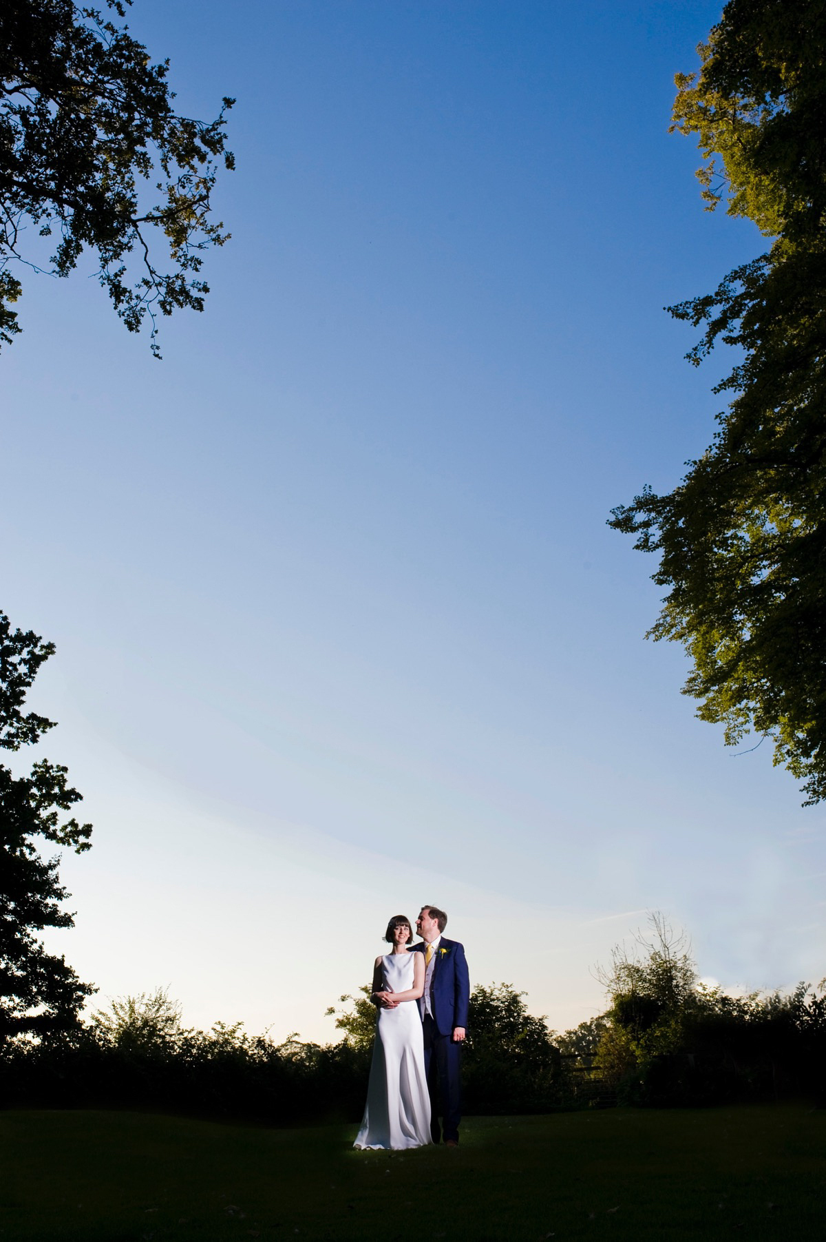 Bride Alice wore a chic, Charlie Brear column style gown for her 1920's and books/literary inspired summer barn wedding. Images by Richard Beaumont.