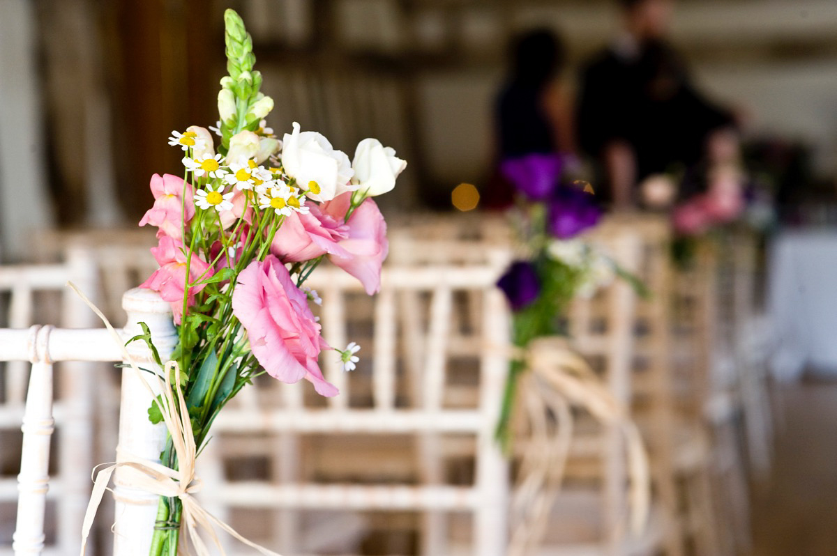 Bride Alice wore a chic, Charlie Brear column style gown for her 1920's and books/literary inspired summer barn wedding. Images by Richard Beaumont.