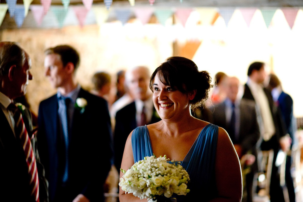 Bride Alice wore a chic, Charlie Brear column style gown for her 1920's and books/literary inspired summer barn wedding. Images by Richard Beaumont.