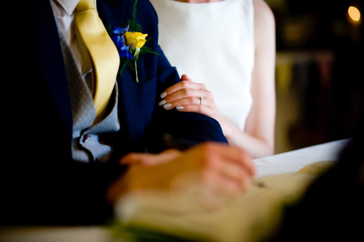 Bride Alice wore a chic, Charlie Brear column style gown for her 1920's and books/literary inspired summer barn wedding. Images by Richard Beaumont.