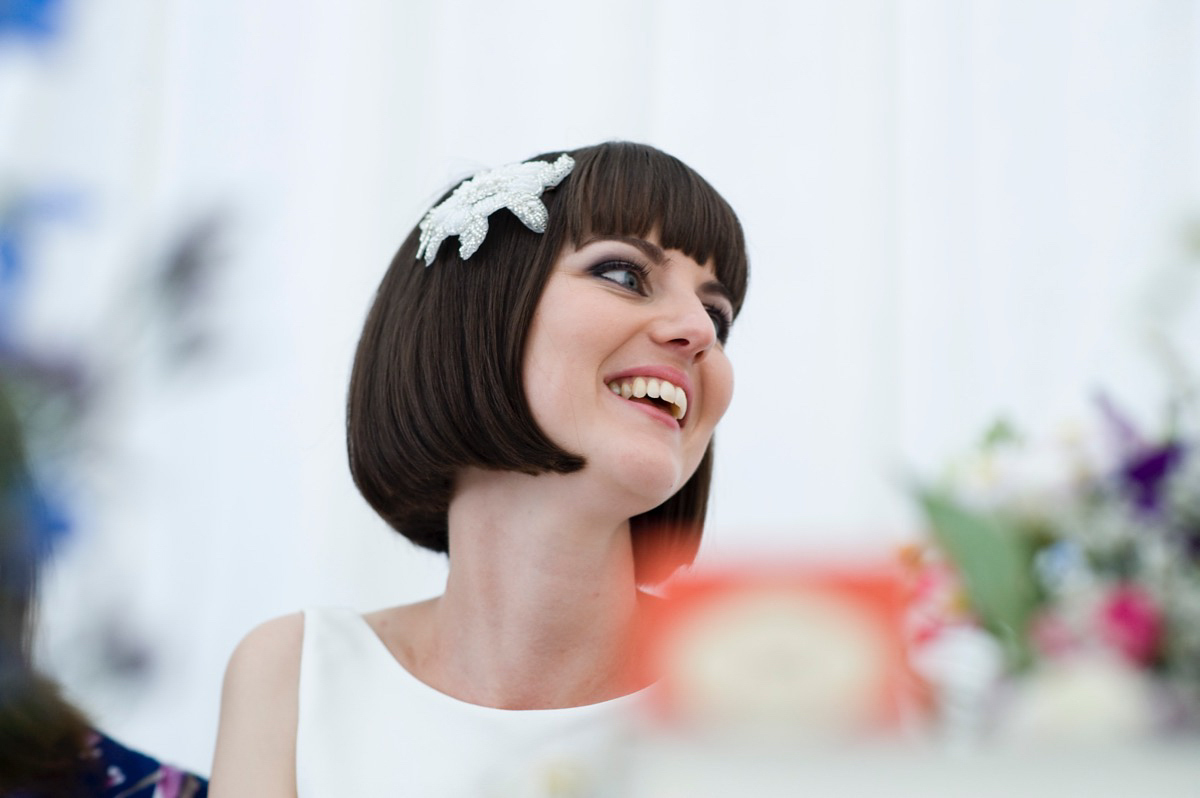 Bride Alice wore a chic, Charlie Brear column style gown for her 1920's and books/literary inspired summer barn wedding. Images by Richard Beaumont.