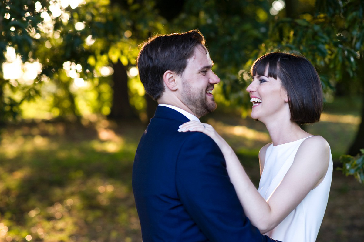 Bride Alice wore a chic, Charlie Brear column style gown for her 1920's and books/literary inspired summer barn wedding. Images by Richard Beaumont.