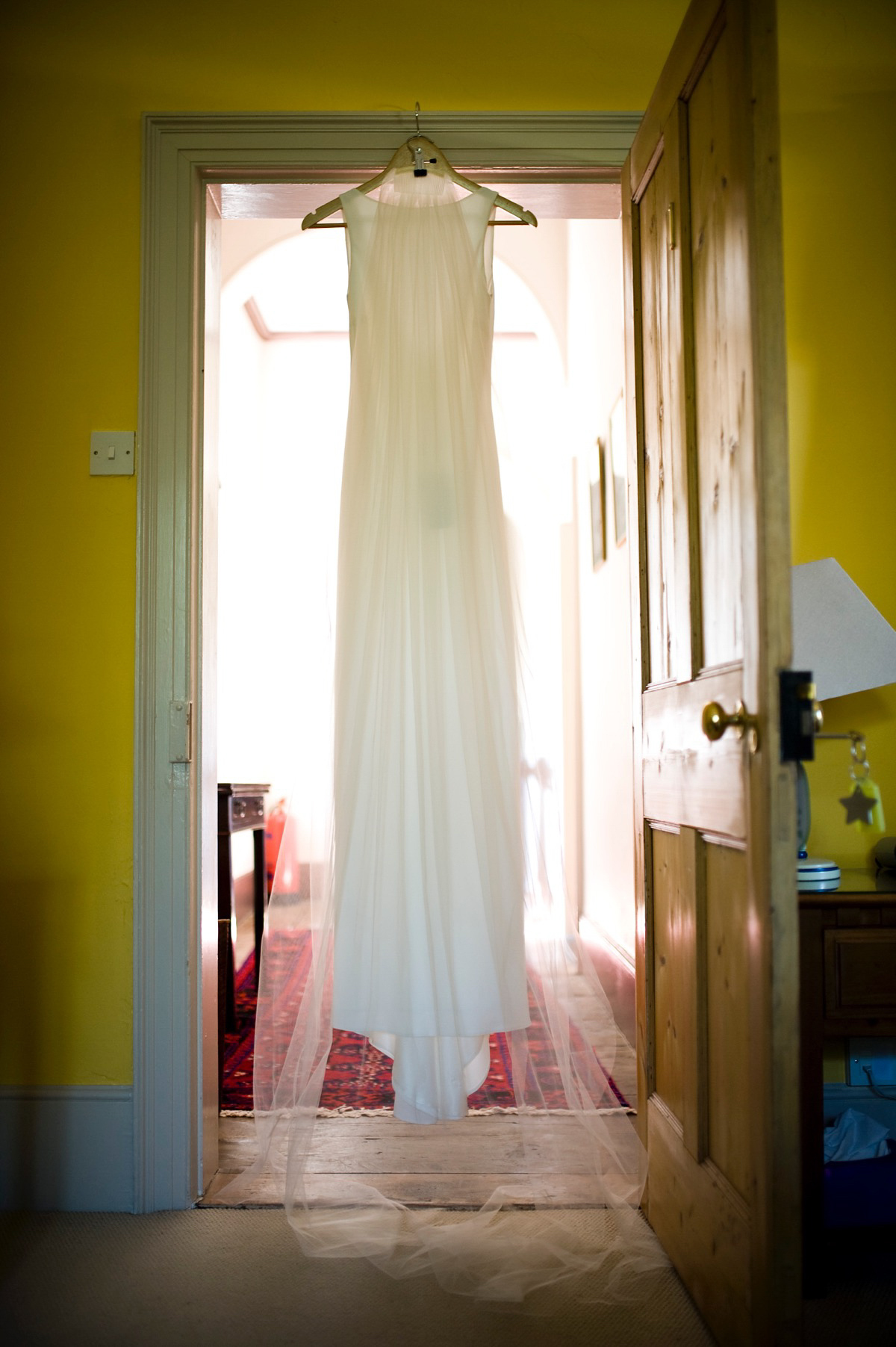 Bride Alice wore a chic, Charlie Brear column style gown for her 1920's and books/literary inspired summer barn wedding. Images by Richard Beaumont.