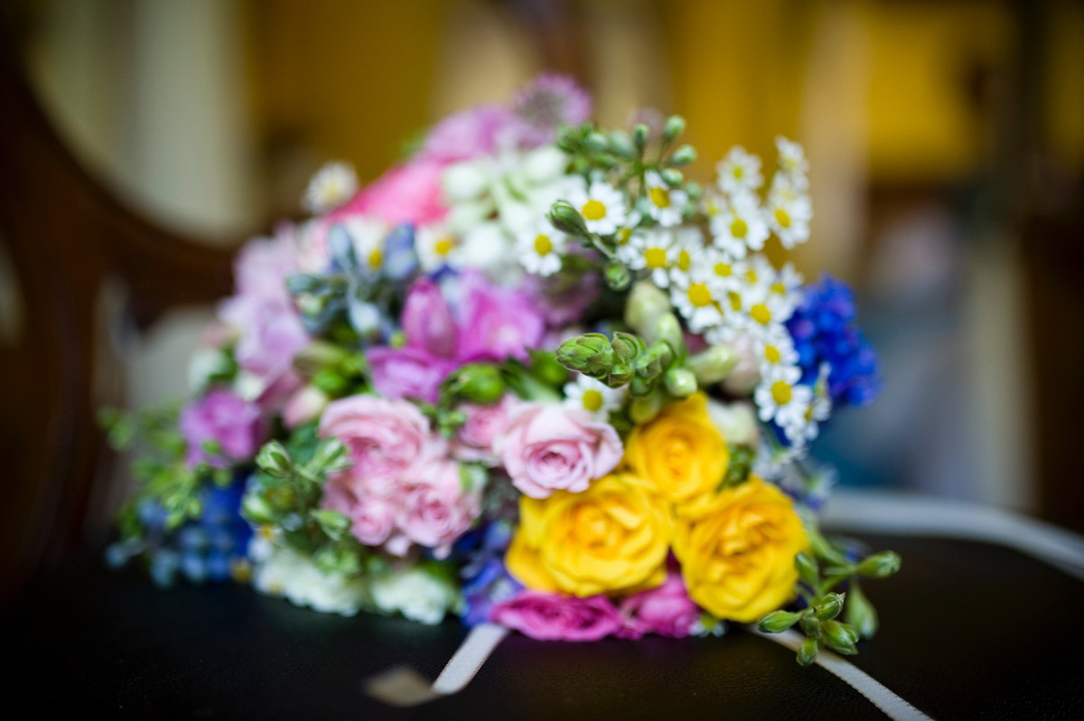 Bride Alice wore a chic, Charlie Brear column style gown for her 1920's and books/literary inspired summer barn wedding. Images by Richard Beaumont.