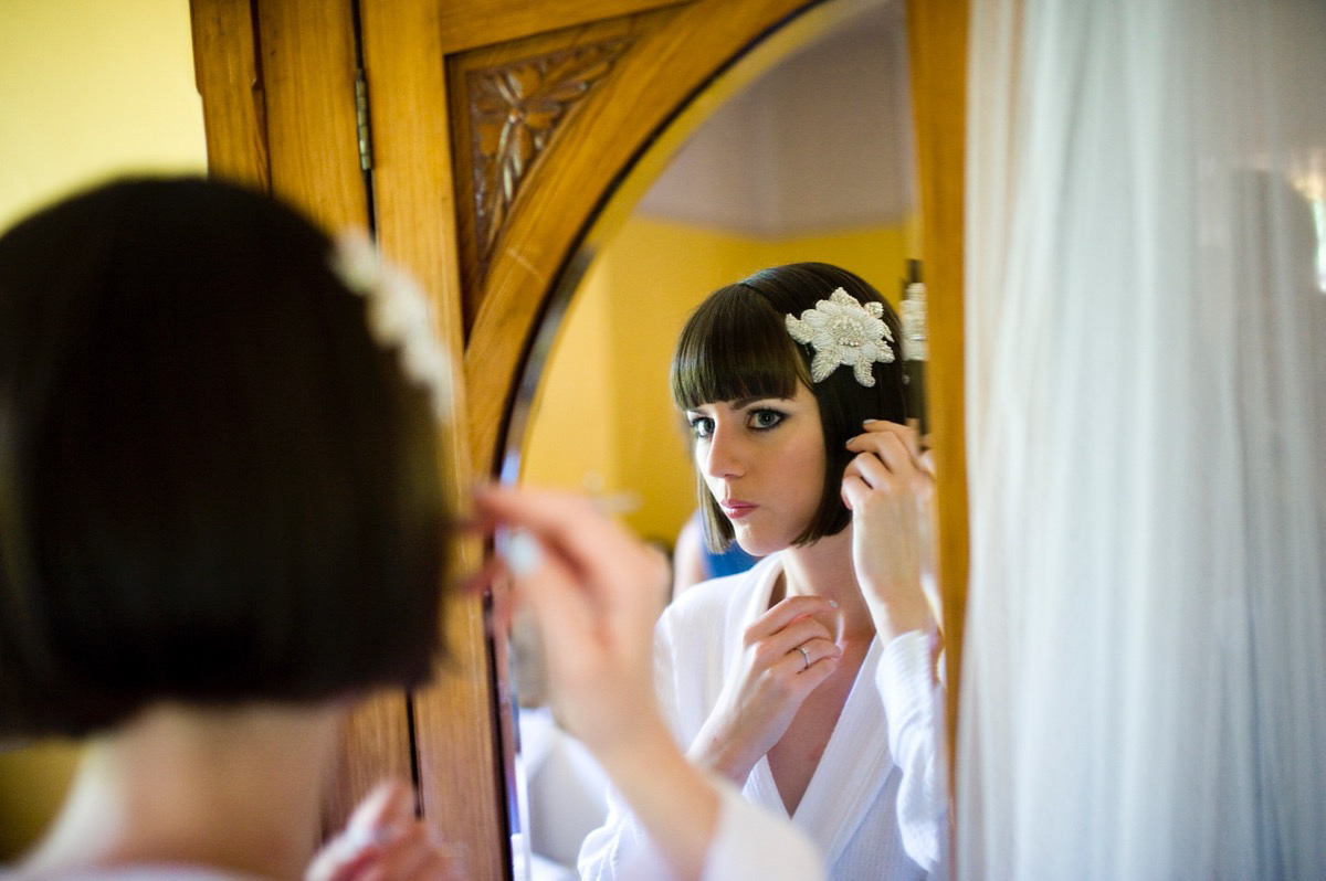 Bride Alice wore a chic, Charlie Brear column style gown for her 1920's and books/literary inspired summer barn wedding. Images by Richard Beaumont.