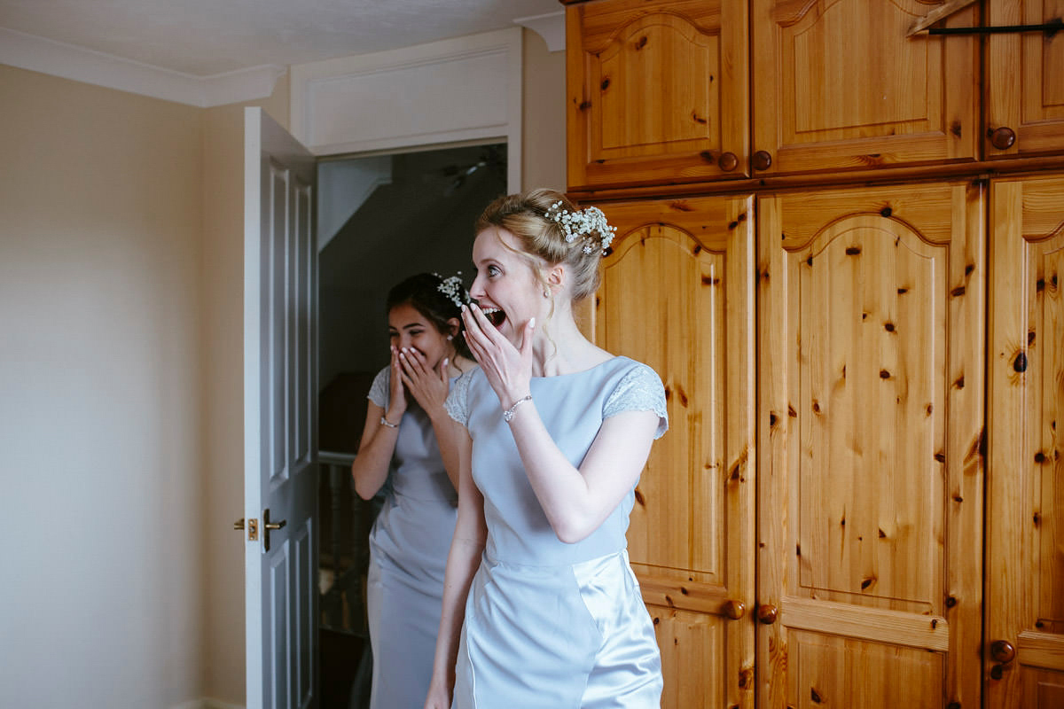 An elegant halterneck dress and bridesmaids in pale blue for a stylish English country wedding. Captured by Ruth Atkins Photography. An elegant halterneck dress and bridesmaids in pale blue for a stylish English country wedding. Captured by Ruth Atkins Photography.