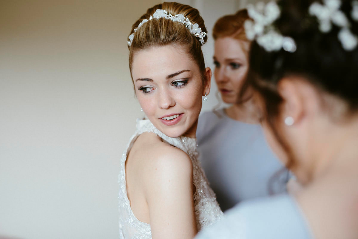 An elegant halterneck dress and bridesmaids in pale blue for a stylish English country wedding. Captured by Ruth Atkins Photography. An elegant halterneck dress and bridesmaids in pale blue for a stylish English country wedding. Captured by Ruth Atkins Photography.