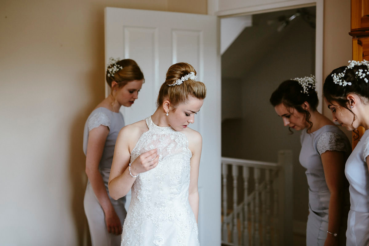 An elegant halterneck dress and bridesmaids in pale blue for a stylish English country wedding. Captured by Ruth Atkins Photography. An elegant halterneck dress and bridesmaids in pale blue for a stylish English country wedding. Captured by Ruth Atkins Photography.