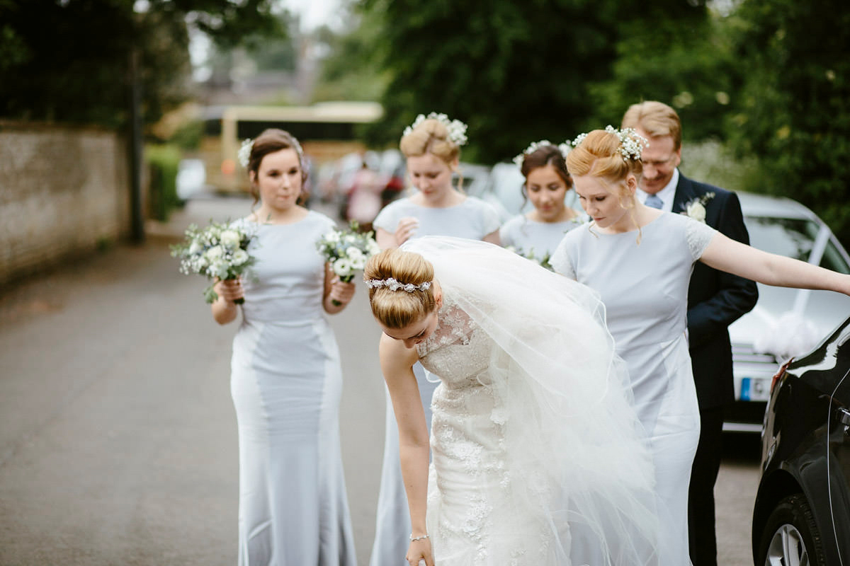 An elegant halterneck dress and bridesmaids in pale blue for a stylish English country wedding. Captured by Ruth Atkins Photography. An elegant halterneck dress and bridesmaids in pale blue for a stylish English country wedding. Captured by Ruth Atkins Photography.