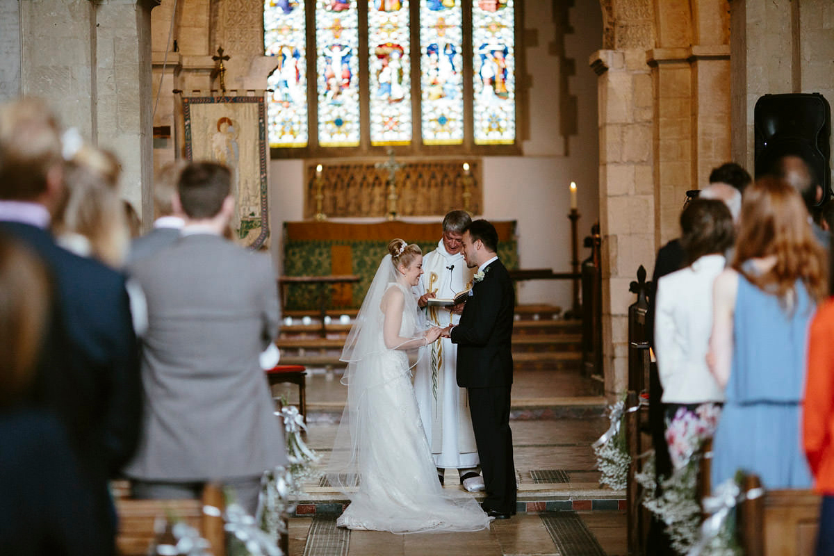 An elegant halterneck dress and bridesmaids in pale blue for a stylish English country wedding. Captured by Ruth Atkins Photography. An elegant halterneck dress and bridesmaids in pale blue for a stylish English country wedding. Captured by Ruth Atkins Photography.