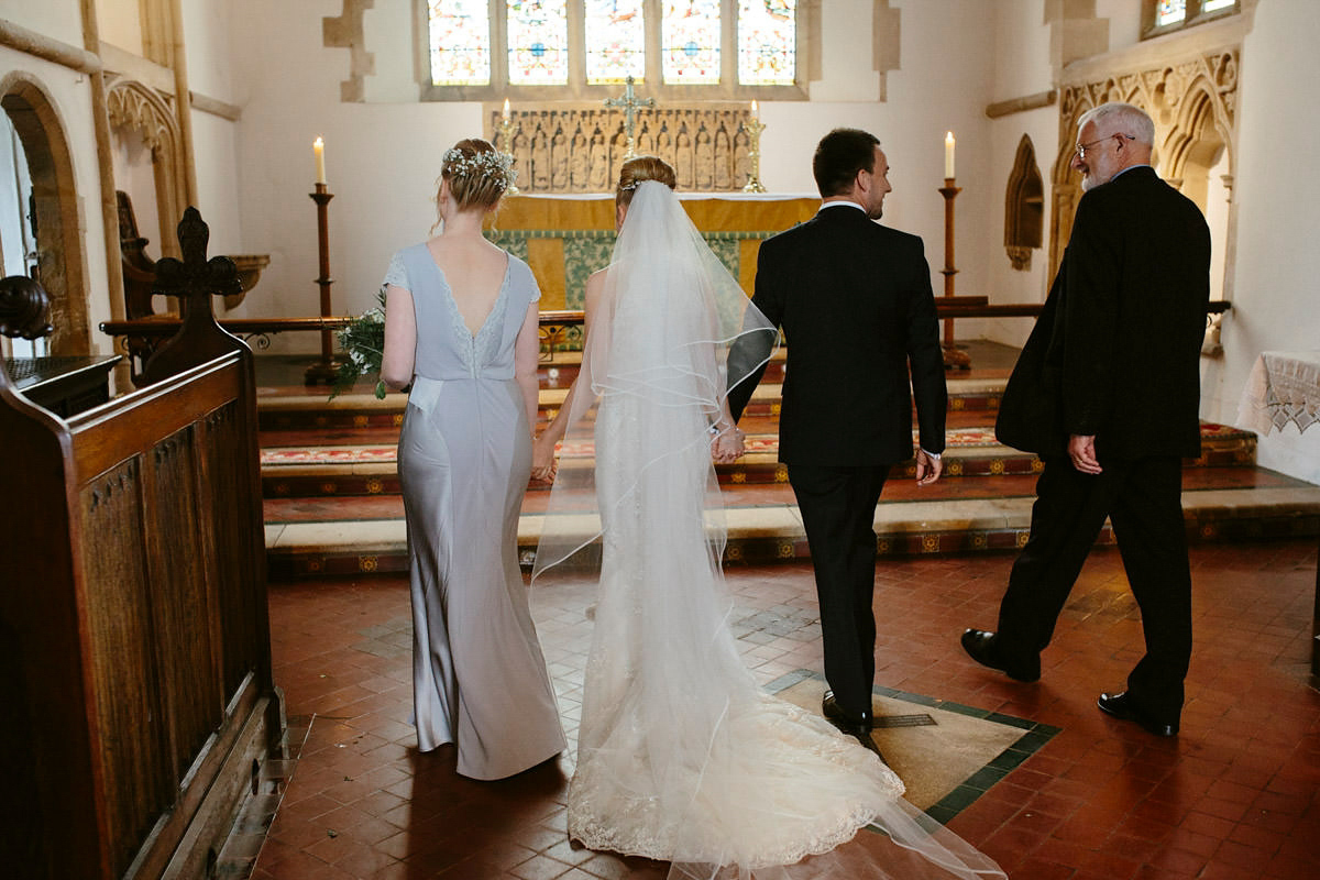 An elegant halterneck dress and bridesmaids in pale blue for a stylish English country wedding. Captured by Ruth Atkins Photography. An elegant halterneck dress and bridesmaids in pale blue for a stylish English country wedding. Captured by Ruth Atkins Photography.