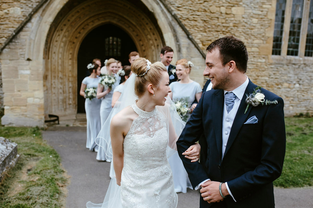 An elegant halterneck dress and bridesmaids in pale blue for a stylish English country wedding. Captured by Ruth Atkins Photography. An elegant halterneck dress and bridesmaids in pale blue for a stylish English country wedding. Captured by Ruth Atkins Photography.