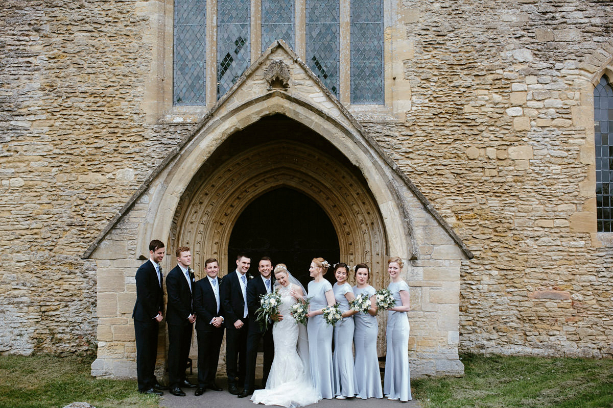 An elegant halterneck dress and bridesmaids in pale blue for a stylish English country wedding. Captured by Ruth Atkins Photography. An elegant halterneck dress and bridesmaids in pale blue for a stylish English country wedding. Captured by Ruth Atkins Photography.