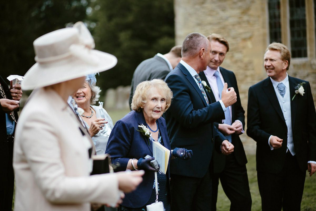 An elegant halterneck dress and bridesmaids in pale blue for a stylish English country wedding. Captured by Ruth Atkins Photography. An elegant halterneck dress and bridesmaids in pale blue for a stylish English country wedding. Captured by Ruth Atkins Photography.