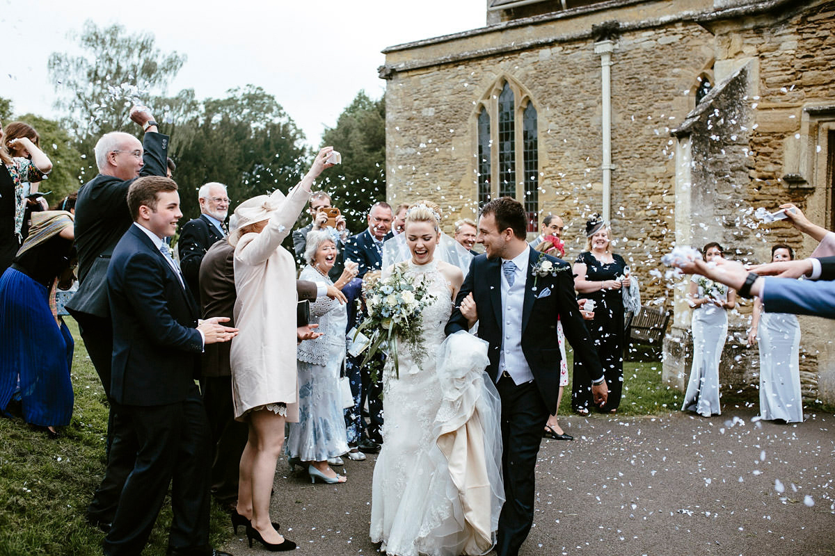 An elegant halterneck dress and bridesmaids in pale blue for a stylish English country wedding. Captured by Ruth Atkins Photography. An elegant halterneck dress and bridesmaids in pale blue for a stylish English country wedding. Captured by Ruth Atkins Photography.