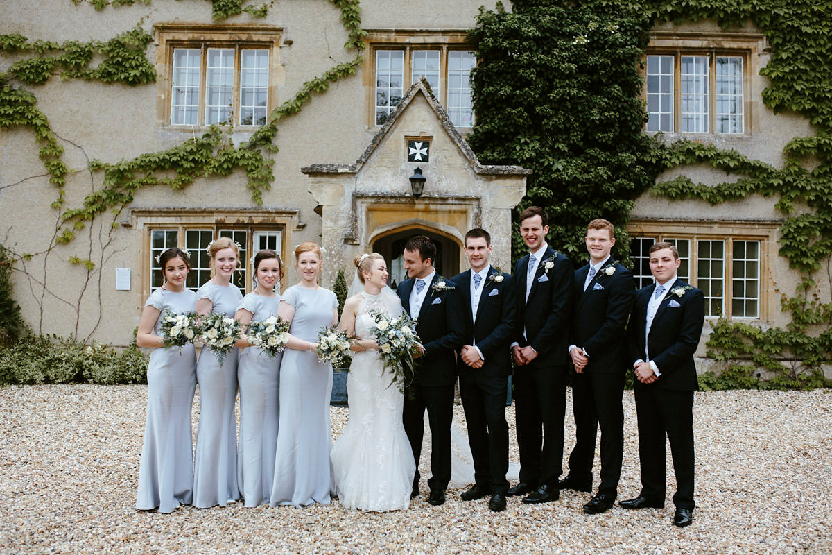 An elegant halterneck dress and bridesmaids in pale blue for a stylish English country wedding. Captured by Ruth Atkins Photography. An elegant halterneck dress and bridesmaids in pale blue for a stylish English country wedding. Captured by Ruth Atkins Photography.