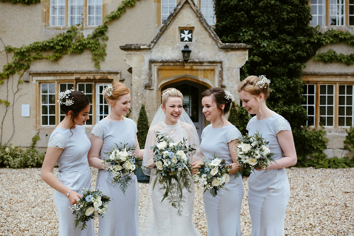 An elegant halterneck dress and bridesmaids in pale blue for a stylish English country wedding. Captured by Ruth Atkins Photography. An elegant halterneck dress and bridesmaids in pale blue for a stylish English country wedding. Captured by Ruth Atkins Photography.