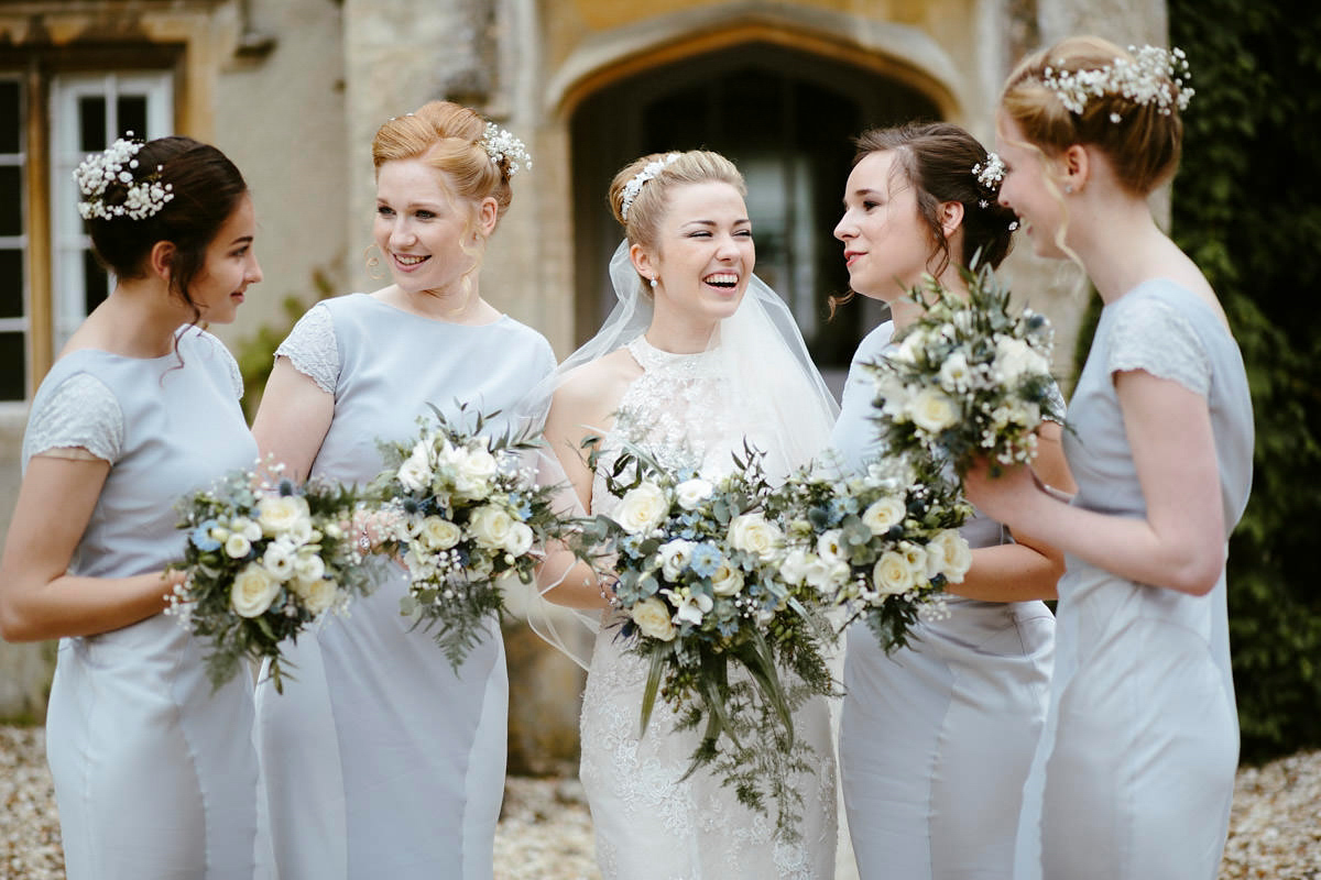 An elegant halterneck dress and bridesmaids in pale blue for a stylish English country wedding. Captured by Ruth Atkins Photography. An elegant halterneck dress and bridesmaids in pale blue for a stylish English country wedding. Captured by Ruth Atkins Photography.