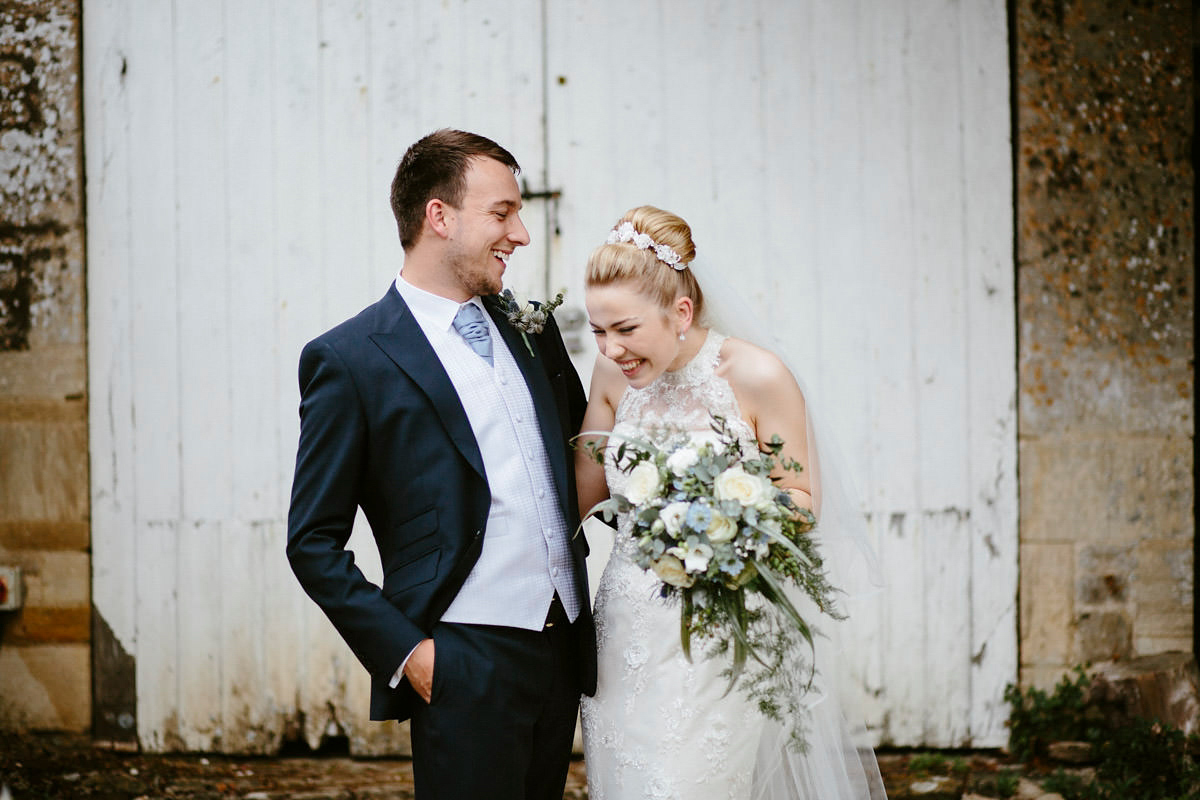 An elegant halterneck dress and bridesmaids in pale blue for a stylish English country wedding. Captured by Ruth Atkins Photography. An elegant halterneck dress and bridesmaids in pale blue for a stylish English country wedding. Captured by Ruth Atkins Photography.