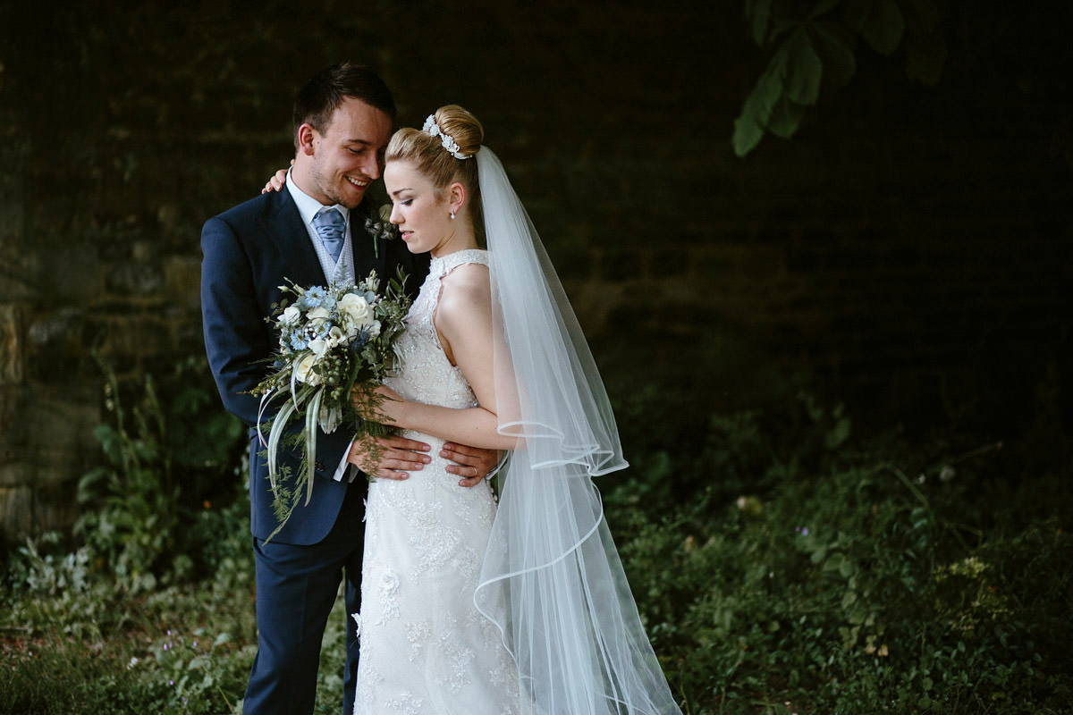 An elegant halterneck dress and bridesmaids in pale blue for a stylish English country wedding. Captured by Ruth Atkins Photography. An elegant halterneck dress and bridesmaids in pale blue for a stylish English country wedding. Captured by Ruth Atkins Photography.