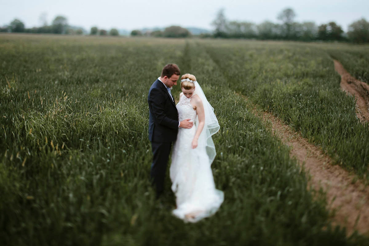 An elegant halterneck dress and bridesmaids in pale blue for a stylish English country wedding. Captured by Ruth Atkins Photography. An elegant halterneck dress and bridesmaids in pale blue for a stylish English country wedding. Captured by Ruth Atkins Photography.