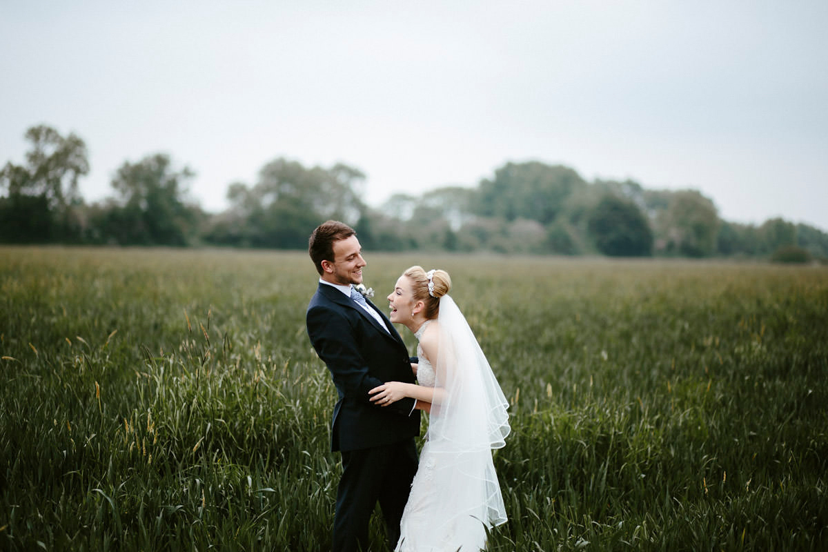 An elegant halterneck dress and bridesmaids in pale blue for a stylish English country wedding. Captured by Ruth Atkins Photography. An elegant halterneck dress and bridesmaids in pale blue for a stylish English country wedding. Captured by Ruth Atkins Photography.