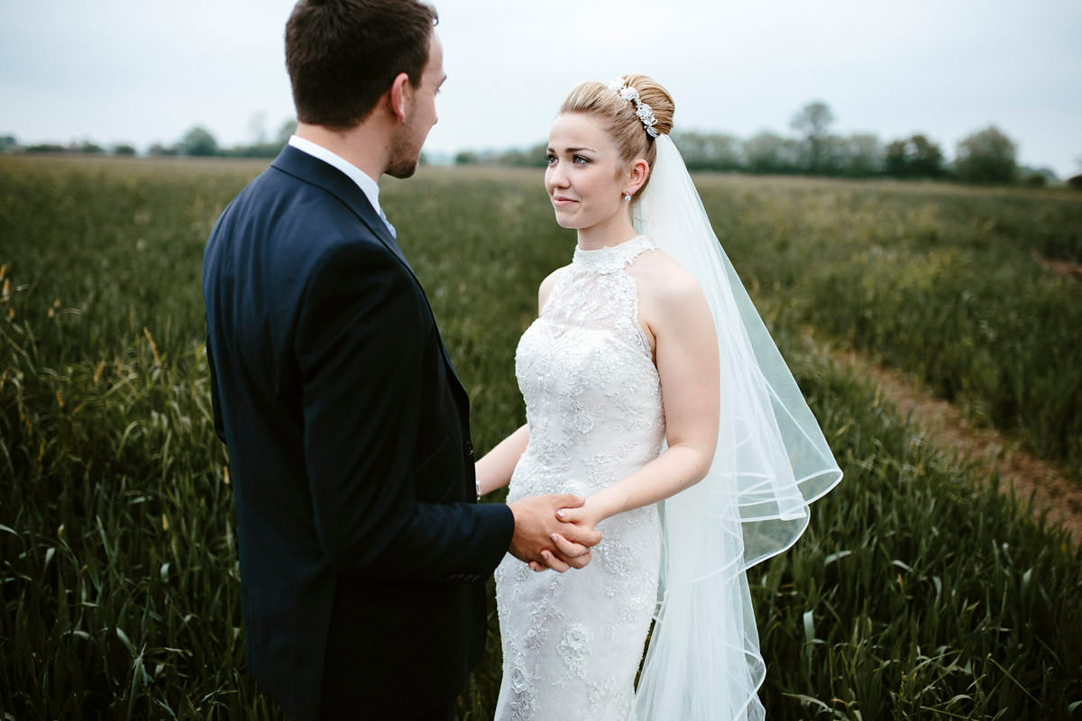 An elegant halterneck dress and bridesmaids in pale blue for a stylish English country wedding. Captured by Ruth Atkins Photography. An elegant halterneck dress and bridesmaids in pale blue for a stylish English country wedding. Captured by Ruth Atkins Photography.