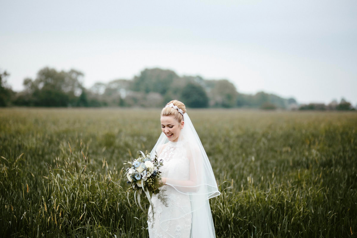 An elegant halterneck dress and bridesmaids in pale blue for a stylish English country wedding. Captured by Ruth Atkins Photography. An elegant halterneck dress and bridesmaids in pale blue for a stylish English country wedding. Captured by Ruth Atkins Photography.
