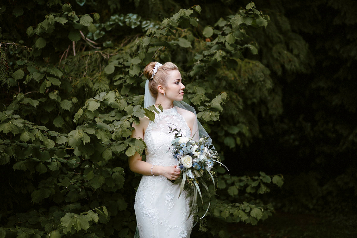 An elegant halterneck dress and bridesmaids in pale blue for a stylish English country wedding. Captured by Ruth Atkins Photography. An elegant halterneck dress and bridesmaids in pale blue for a stylish English country wedding. Captured by Ruth Atkins Photography.