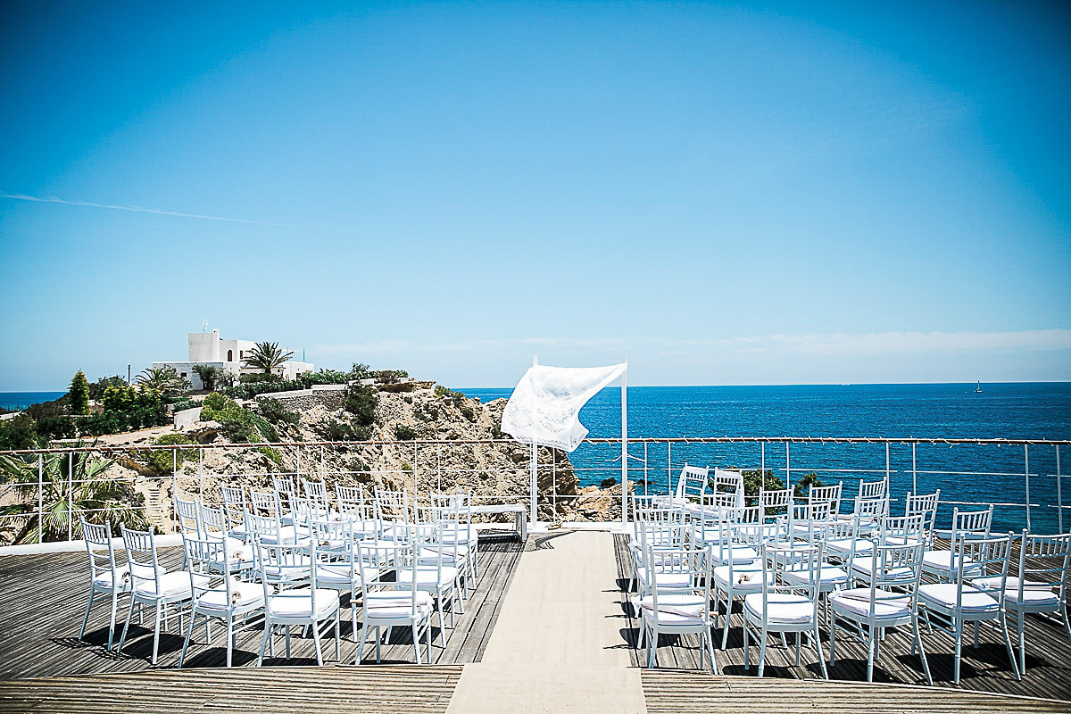 Karen wore an Enzoani gown for her Ibiza destination wedding, her bridesmaids wore Virgos Lounge floor length beaded gowns. Photography by Samie Lee.