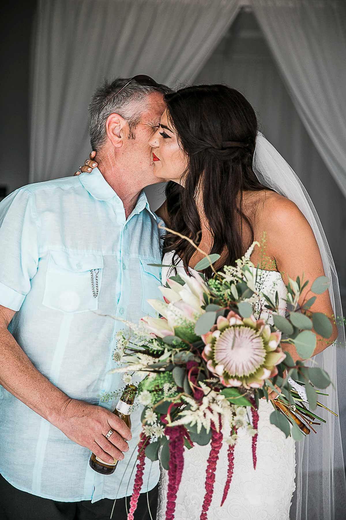 Karen wore an Enzoani gown for her Ibiza destination wedding, her bridesmaids wore Virgos Lounge floor length beaded gowns. Photography by Samie Lee.