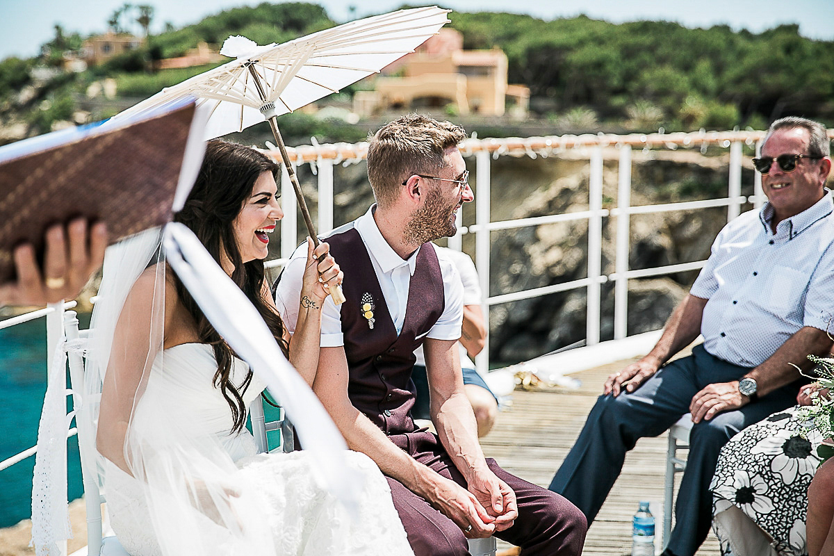 Karen wore an Enzoani gown for her Ibiza destination wedding, her bridesmaids wore Virgos Lounge floor length beaded gowns. Photography by Samie Lee.