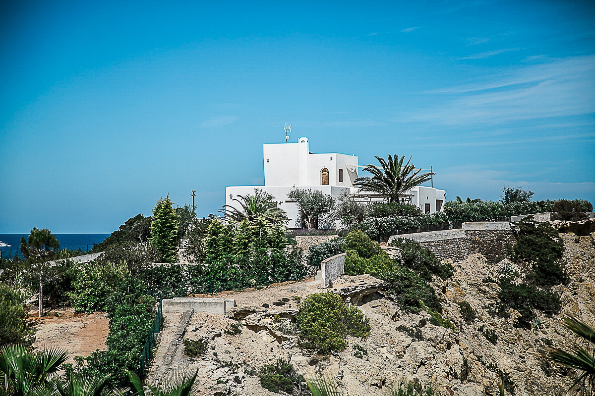 Karen wore an Enzoani gown for her Ibiza destination wedding, her bridesmaids wore Virgos Lounge floor length beaded gowns. Photography by Samie Lee.