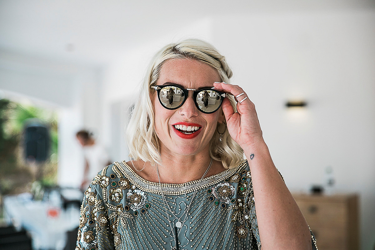 Karen wore an Enzoani gown for her Ibiza destination wedding, her bridesmaids wore Virgos Lounge floor length beaded gowns. Photography by Samie Lee.