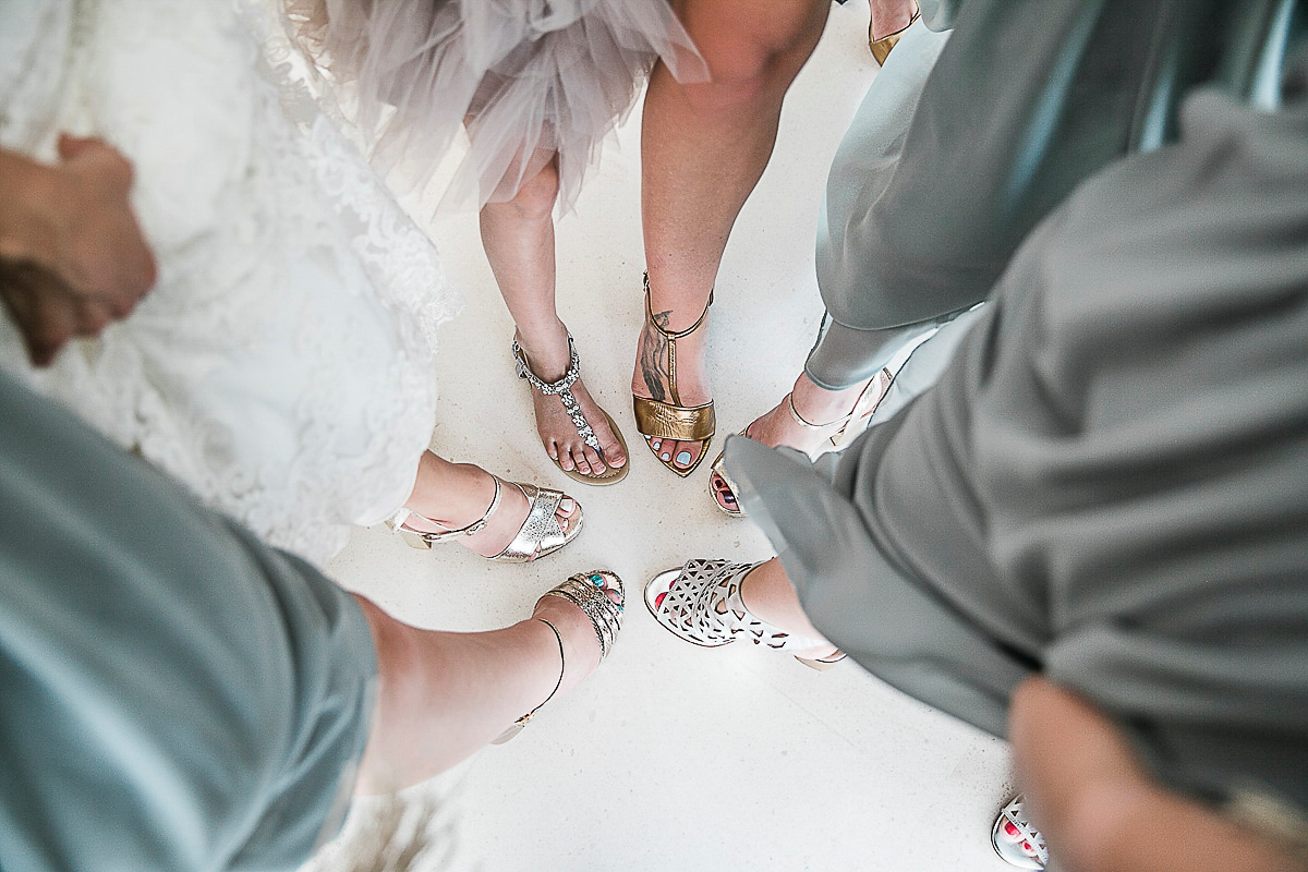 Karen wore an Enzoani gown for her Ibiza destination wedding, her bridesmaids wore Virgos Lounge floor length beaded gowns. Photography by Samie Lee.