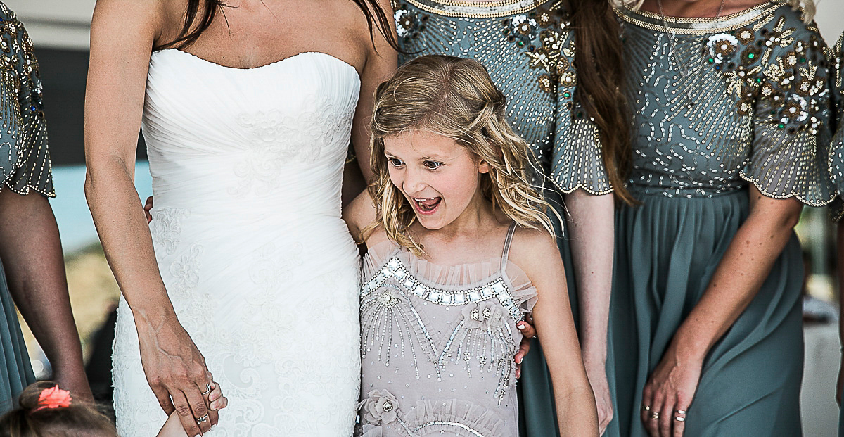 Karen wore an Enzoani gown for her Ibiza destination wedding, her bridesmaids wore Virgos Lounge floor length beaded gowns. Photography by Samie Lee.