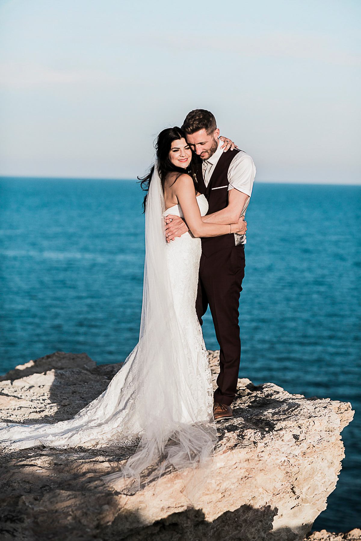 Karen wore an Enzoani gown for her Ibiza destination wedding, her bridesmaids wore Virgos Lounge floor length beaded gowns. Photography by Samie Lee.