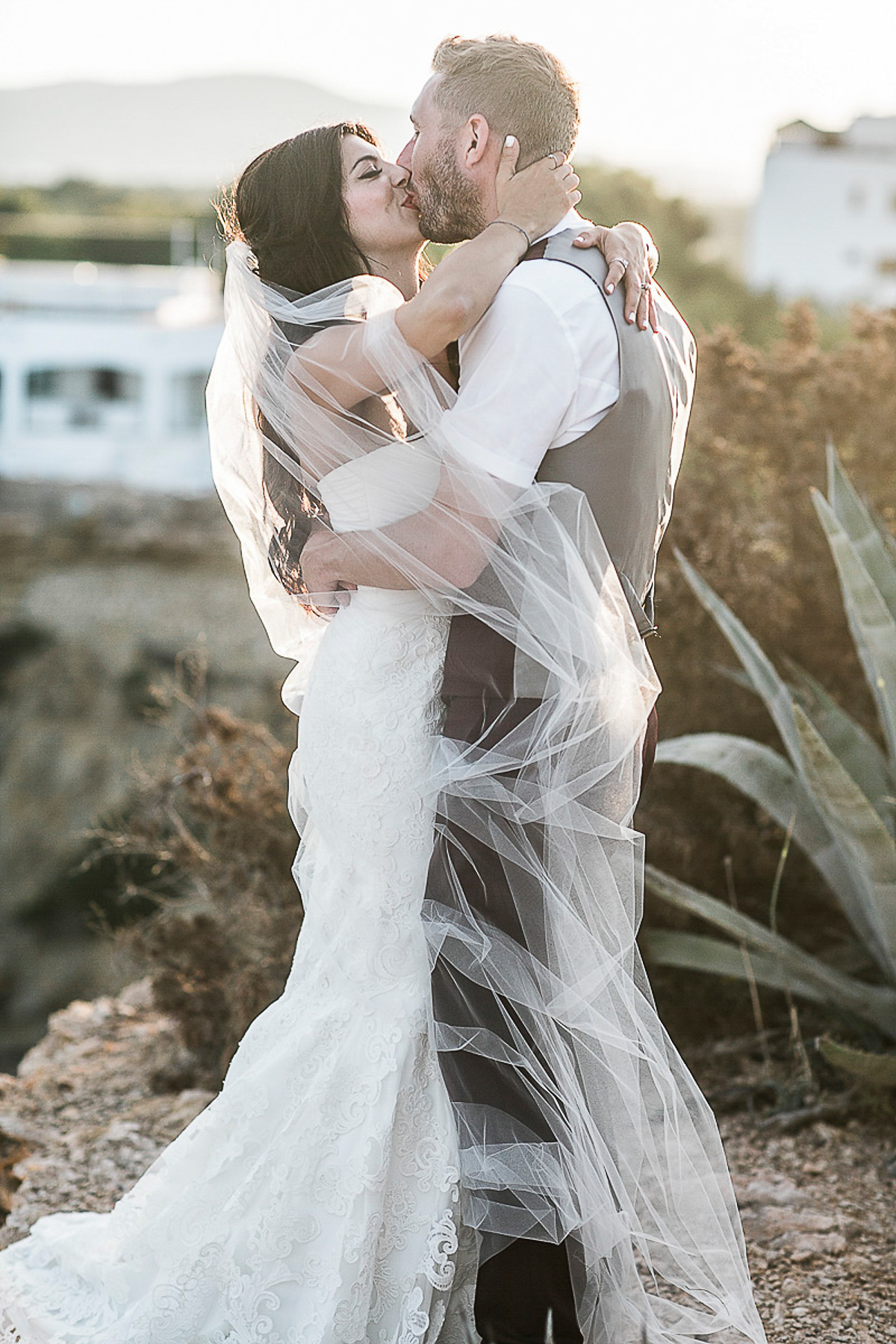 Karen wore an Enzoani gown for her Ibiza destination wedding, her bridesmaids wore Virgos Lounge floor length beaded gowns. Photography by Samie Lee.