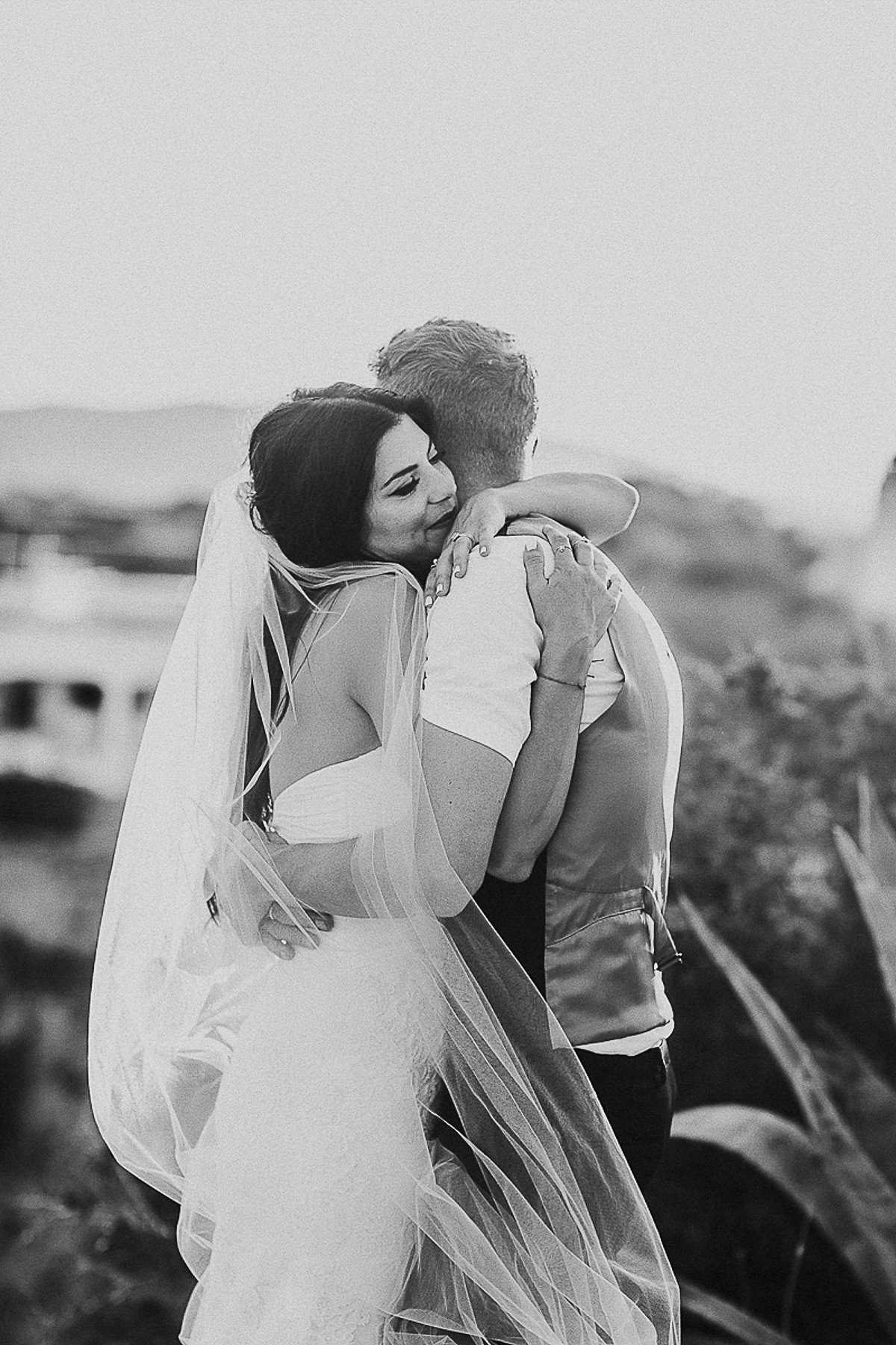 Karen wore an Enzoani gown for her Ibiza destination wedding, her bridesmaids wore Virgos Lounge floor length beaded gowns. Photography by Samie Lee.