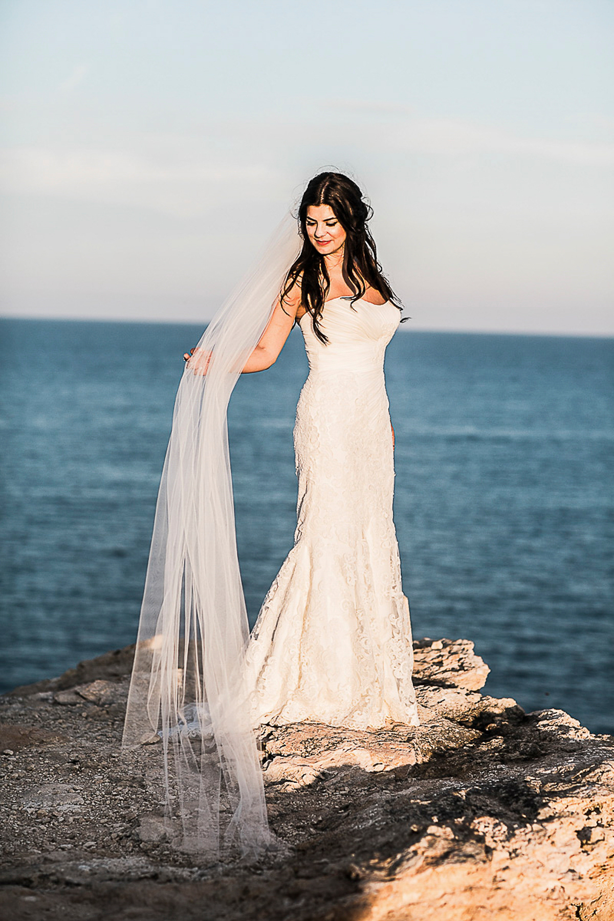 Karen wore an Enzoani gown for her Ibiza destination wedding, her bridesmaids wore Virgos Lounge floor length beaded gowns. Photography by Samie Lee.