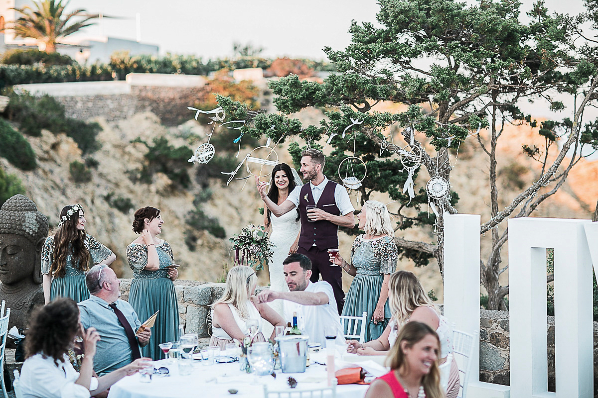 Karen wore an Enzoani gown for her Ibiza destination wedding, her bridesmaids wore Virgos Lounge floor length beaded gowns. Photography by Samie Lee.