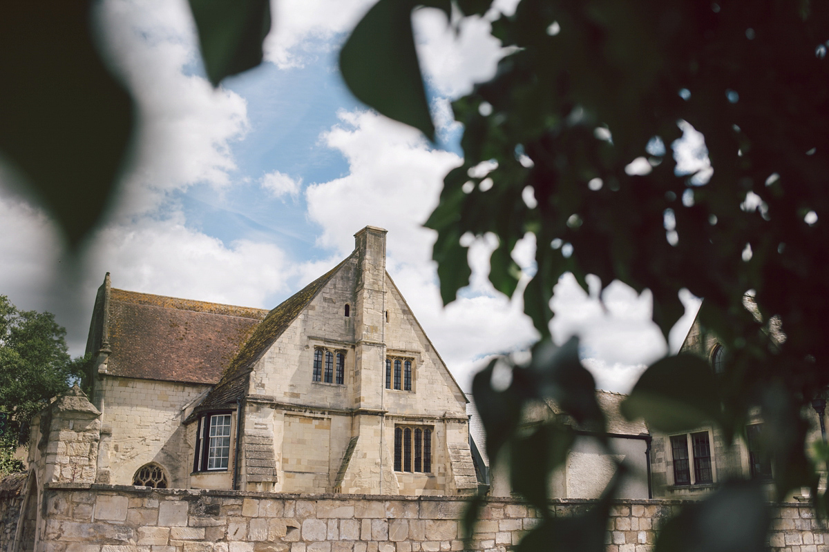 Barefoot bride Zoё wore a dress she had designed herself for her effortlessly elegant wedding at Blackfriar medieval priory in Gloucester. Captured by Grace Elizabeth Photography.