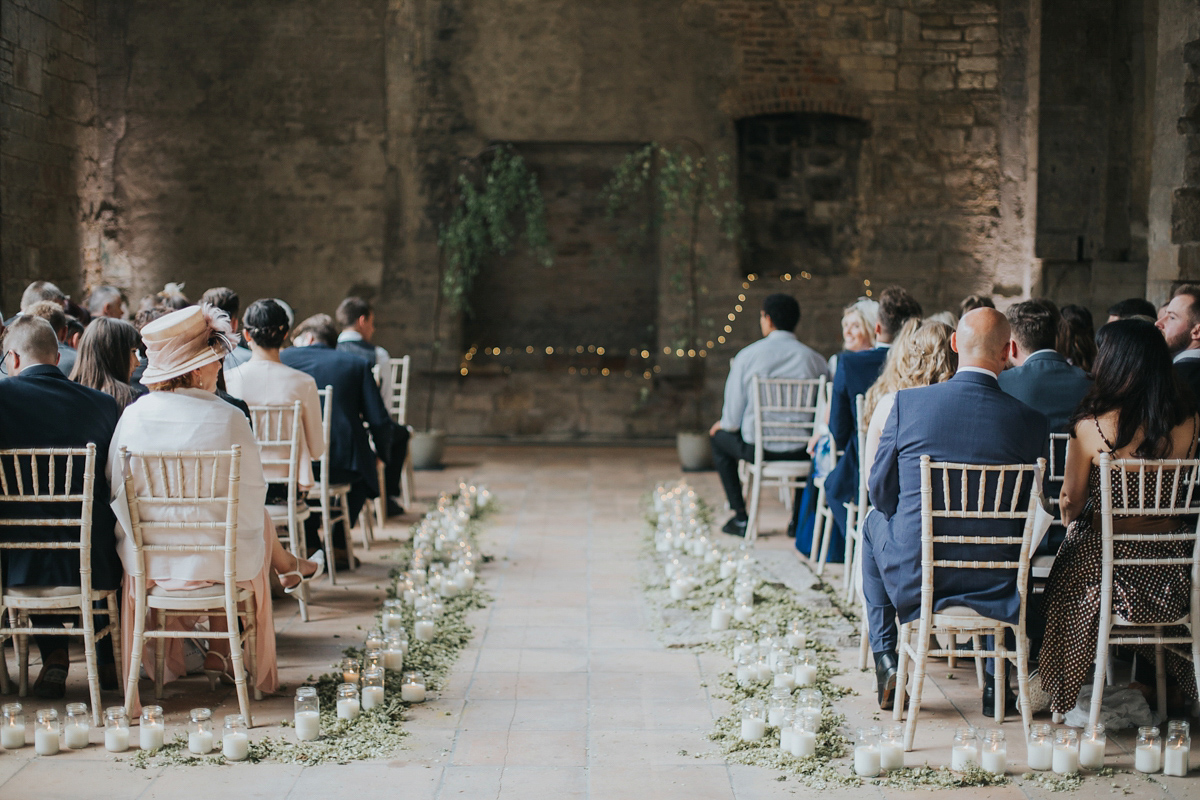 Barefoot bride Zoё wore a dress she had designed herself for her effortlessly elegant wedding at Blackfriar medieval priory in Gloucester. Captured by Grace Elizabeth Photography.